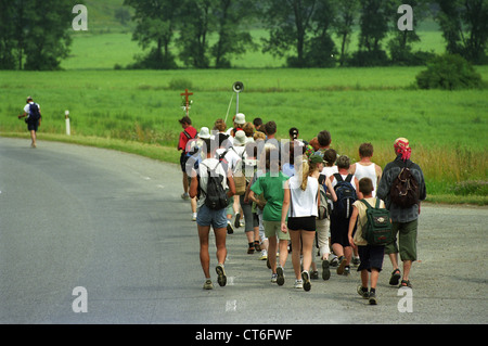 A group of pilgrims on a country road, Slovakia Stock Photo