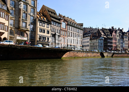 Many timbered,half-timbered houses,Quai des Bateliers,Open Top Tourist River Boats,Bateau Mouche,L'Ill River,Strasbourg,France Stock Photo
