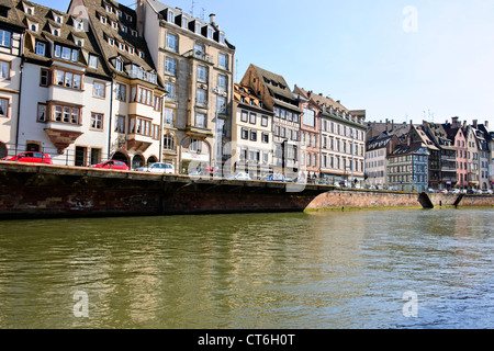 Many timbered,half-timbered houses,Quai des Bateliers,Open Top Tourist River Boats,Bateau Mouche,L'Ill River,Strasbourg,France Stock Photo