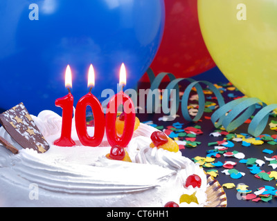 Birthday-anniversary cake with red candle showing Nr. 100 Stock Photo