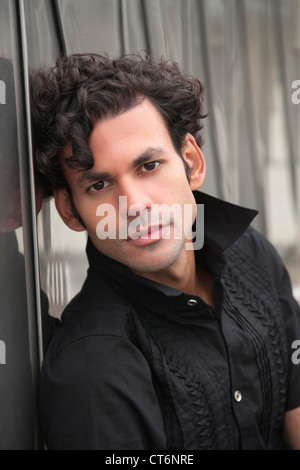 Portrait of a handsome young man posing in black shirt Stock Photo