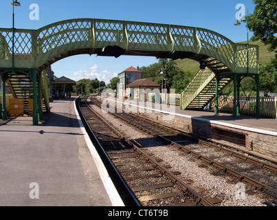 Footbridge over train tracks, Corfe Castle Train Station, Dorset, Devon, UK Stock Photo