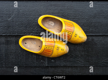 traditional dutch wooden shoes hanging at a wall Stock Photo