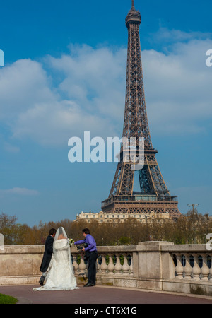 Paris, France, Chinese Wedding, Couple, Wedding Dress, Outside, Street, near  Eiffel Tower, Photographer Taking photos Stock Photo