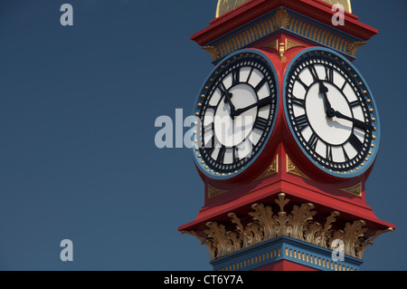 The freshly painted victorian Jubilee clock tower on Weymouth seafront was erected in 1887 to mark fifty years of Queen Victoria’s reign. Dorset, UK. Stock Photo