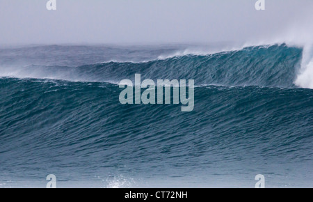 Two large waves in the winter rain Stock Photo