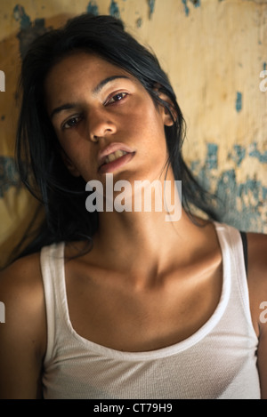 Domestic violence, portrait of abused and hurt young woman crying at home Stock Photo
