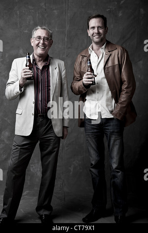 Grown-up father and son having a beer Stock Photo