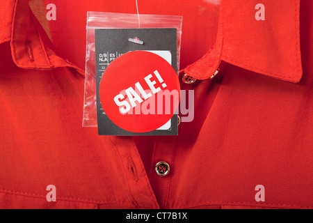 Sale tag on red blouse Stock Photo