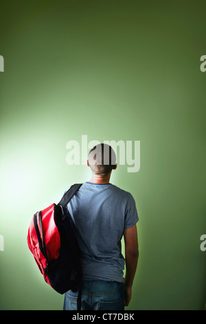 Schoolboy with backpack, rear view Stock Photo