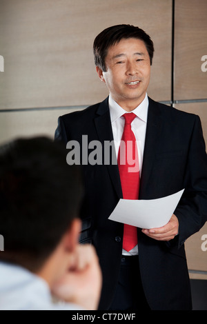 Businessman giving presentation Stock Photo