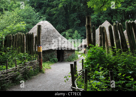 Iron Age Village (reproduction). An archaeological experiment showing how people might have lived 2500 years ago. Round house architecture as found near a hillfort near Conderton, Worcestershire. It is believed that most Celts lived in small communities (family) in settlements such as this. The stockade and surrounding ditch provide defense from rival communities and wild animals Stock Photo