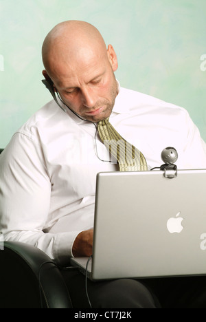 Man has fallen asleep on his PowerBook Stock Photo