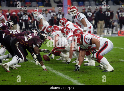 NFL Europe League Championship Final World Super Bowl Frankfurt Galaxy  Adesola Badon holds off Rhein Fire defence at the Hampden Park stadium in  Glasgow Stock Photo - Alamy