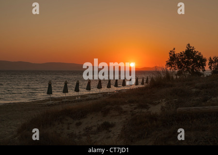 Plaka beach in Naxos, Greece, at sunset, in the background the island of Paros Stock Photo