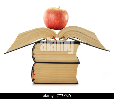 Composition with stack of books and apple isolated on white Stock Photo