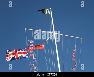 Flags flying above a yacht club Stock Photo