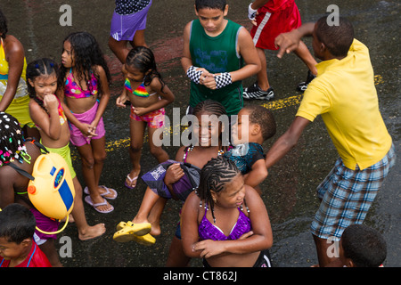 Panamanian Carnival tradition of the 'mojaderas' or 'getting drenched' with water on Isla Colon, Bocas del Toro, Panama. Stock Photo