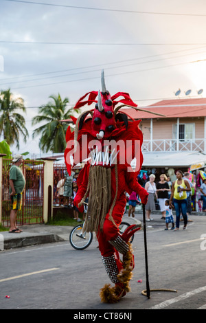 'Whipping Devils' patrol the streets during the Panamanian Carnival celebration on Isla Colon, Bocas del Toro, Panama. Stock Photo