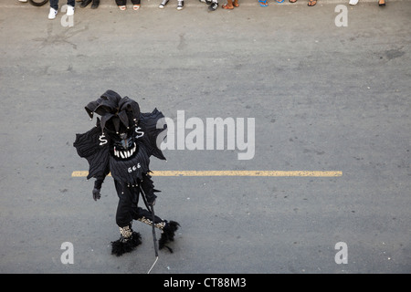 'Whipping Devils' patrol the streets during the Panamanian Carnival celebration on Isla Colon, Bocas del Toro, Panama. Stock Photo