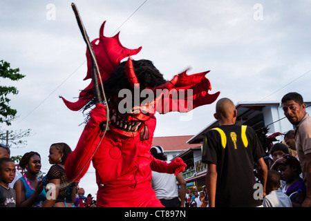 'Whipping Devils' patrol the streets during the Panamanian Carnival celebration on Isla Colon, Bocas del Toro, Panama. Stock Photo