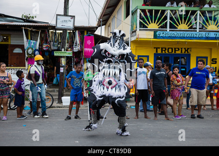 'Whipping Devils' patrol the streets during the Panamanian Carnival celebration on Isla Colon, Bocas del Toro, Panama. Stock Photo