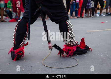 'Whipping Devils' patrol the streets during the Panamanian Carnival celebration on Isla Colon, Bocas del Toro, Panama. Stock Photo