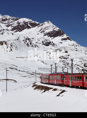 The Bernina Express red train at Alp Grum station, Graubunden Stock ...