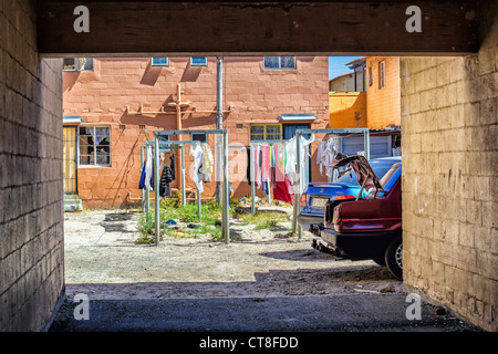 A view of a courtyard, washing lines and cars in Langa African Township near Cape Town, South Africa Stock Photo