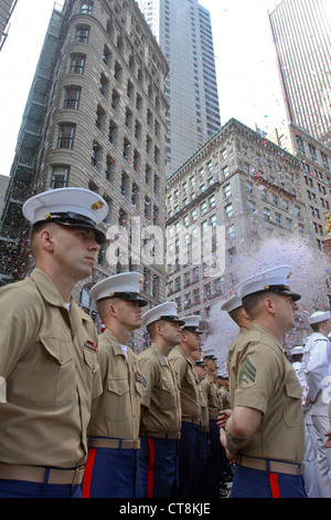 Marines and sailors stand at parade rest during a 4th of July celebration as part of Boston Navy Week 2012. This celebration is one of 15 signature events planned across America in 2012. The eight-day long event commemorates the Bicentennial of the War of 1812, hosting service members from the U.S. Navy, Marine Corps and Coast Guard and coalition ships from around the world. Stock Photo