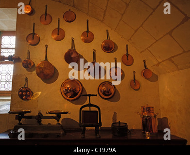 Copper pans and other kitchen implements in the kitchens of Chateau Chenonceau, France Stock Photo