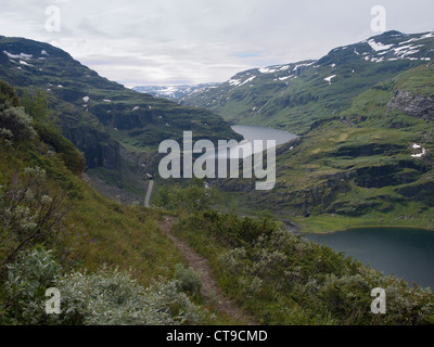 Birds-eye view of dam, tunnel path and mountains on the Norwegian  Aurlandsdalen hiking route Stock Photo