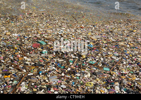 image of a polluted manila bay shore with toxic garbage floating. Stock Photo