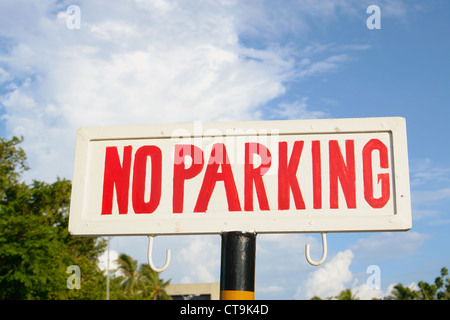 image of a street sign 'no parking', with sky in the background. Stock Photo