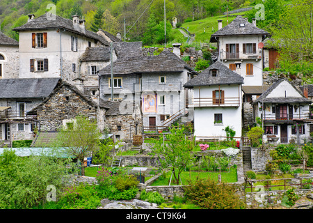 Lavertezzo,Helicopter Delivering Material to Hillside House above Village,Val Verzasca,Verzasca River,Ticino,Switzerland Stock Photo