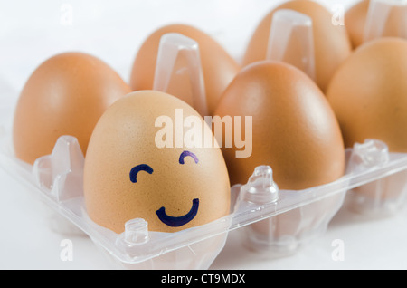 brown eggs with happy face and friends . Stock Photo