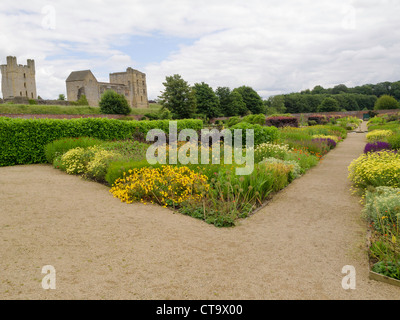 Helmsley Castle overlooking the Helmsley Walled Garden with a show of summer flowers Stock Photo