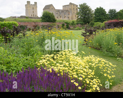 Helmsley Castle overlooking the Helmsley Walled Garden with a show of summer flowers Stock Photo