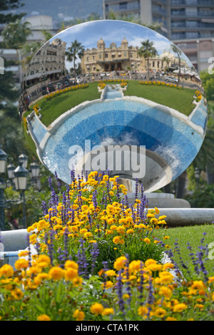 The Monte Carlo Casino reflection in 'sky mirror' sculpture, Place du Casino, Monte Carlo, Principality of Monaco Stock Photo