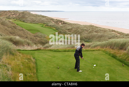 Golfers on the new Trump International Golf Links course in Aberdeenshire, Scotland, UK. Owned by businessman Donald Trump. Stock Photo
