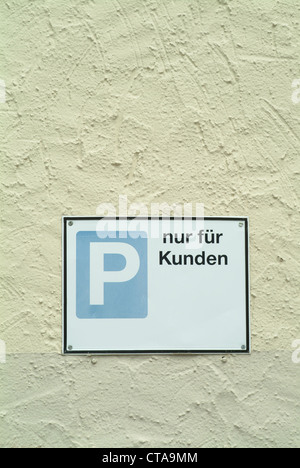 Yellow wall with inscription plate-P only for customers Stock Photo