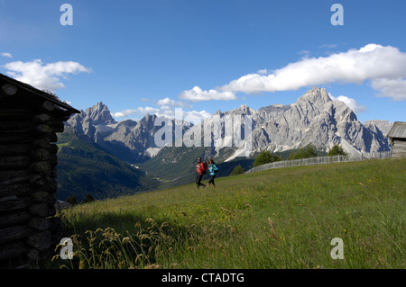 Two hikers, Sexten valley, Sexten Dolomites, Puster valley, UNESCO World Nature Site, Dolomites, South Tyrol, Trentino-Alto Adig Stock Photo