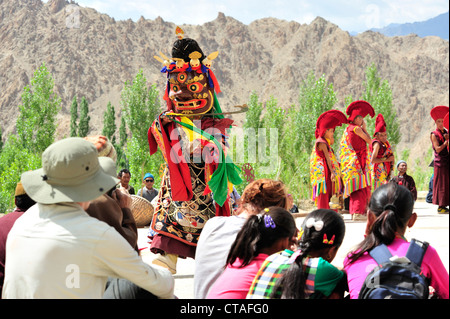 Tourists watching mask dance, monastery festival, Phyang, Leh, valley of Indus, Ladakh, Jammu and Kashmir, India Stock Photo