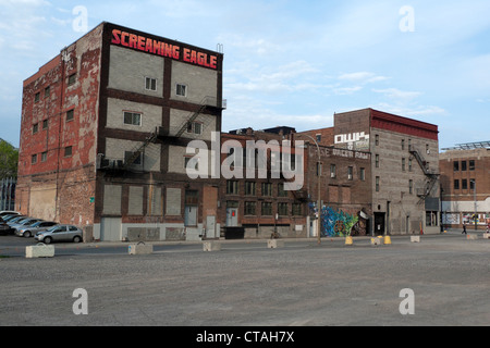 View of empty parking lot and buildings with graffiti Montreal Quebec Canada Stock Photo