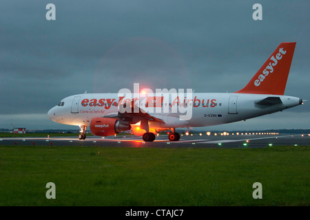 EasyJet A319-111 G-EZBR taxi's onto runway 27 on an early departure from John Lennon Airport Pic Colin Paxton/CP Photography Stock Photo