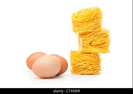 Fresh unprepared noodles and eggs Stock Photo