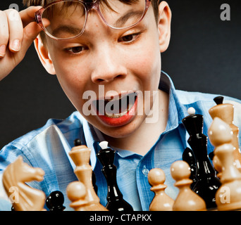 Nerd play chess on a black  background Stock Photo