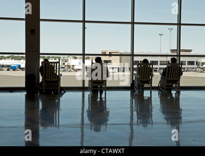 Rocking chairs are provided for passengers at Logan Airport in Boston. Stock Photo