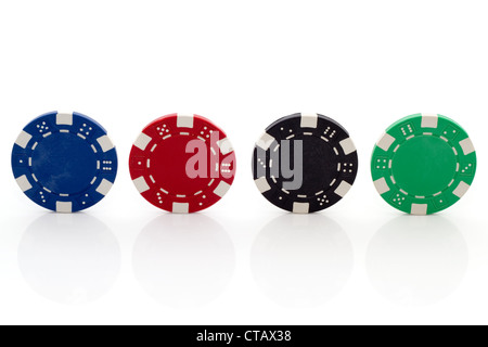 Four Different Poker Chips on White Background Stock Photo