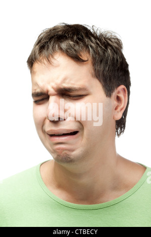 portrait of crying young man isolated on white background Stock Photo